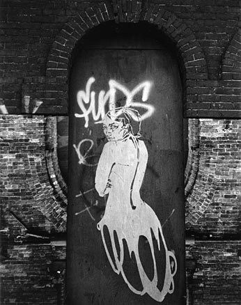 B&W paper cut-out of a woman
