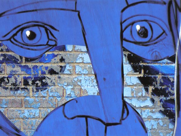 Spray painted big blue face, eyes and nose