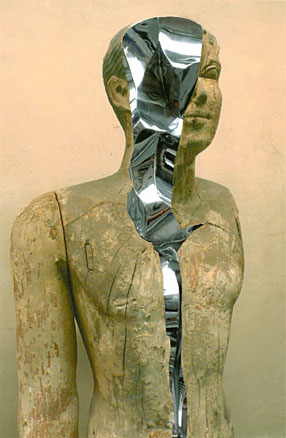 Ancient Egyptian wooden statue cracks open to reveal twisting chrome.