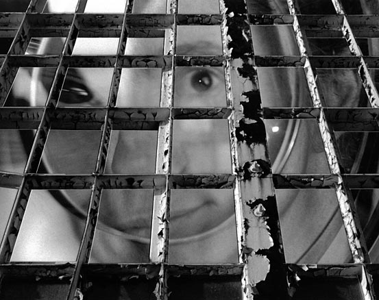 B&W grid over distorted woman's face