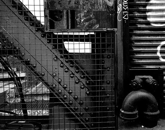 B&W grill, rivets and gate, after Mondrian