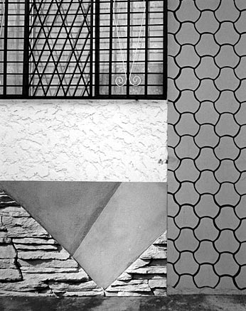 B&W tiles, stucco, stone work and window gates, after Mondrian