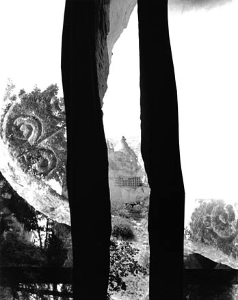 B&W crevasse with crumbling monastery complex