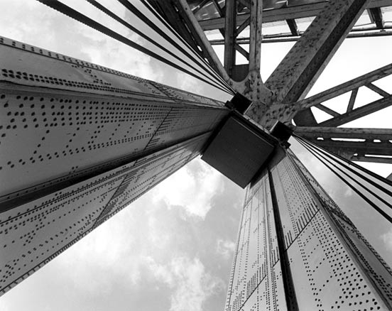 Pedestrian bridge to Wards Island, New York City B&W vertical beams with rivets