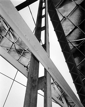 B&W bridge with chain link fence 