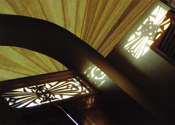 Arch over stuttered window, radiating palm leaf