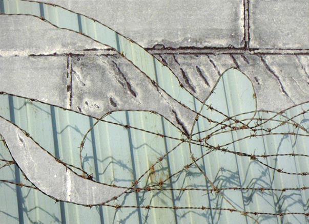 Paving stones with barbed wire